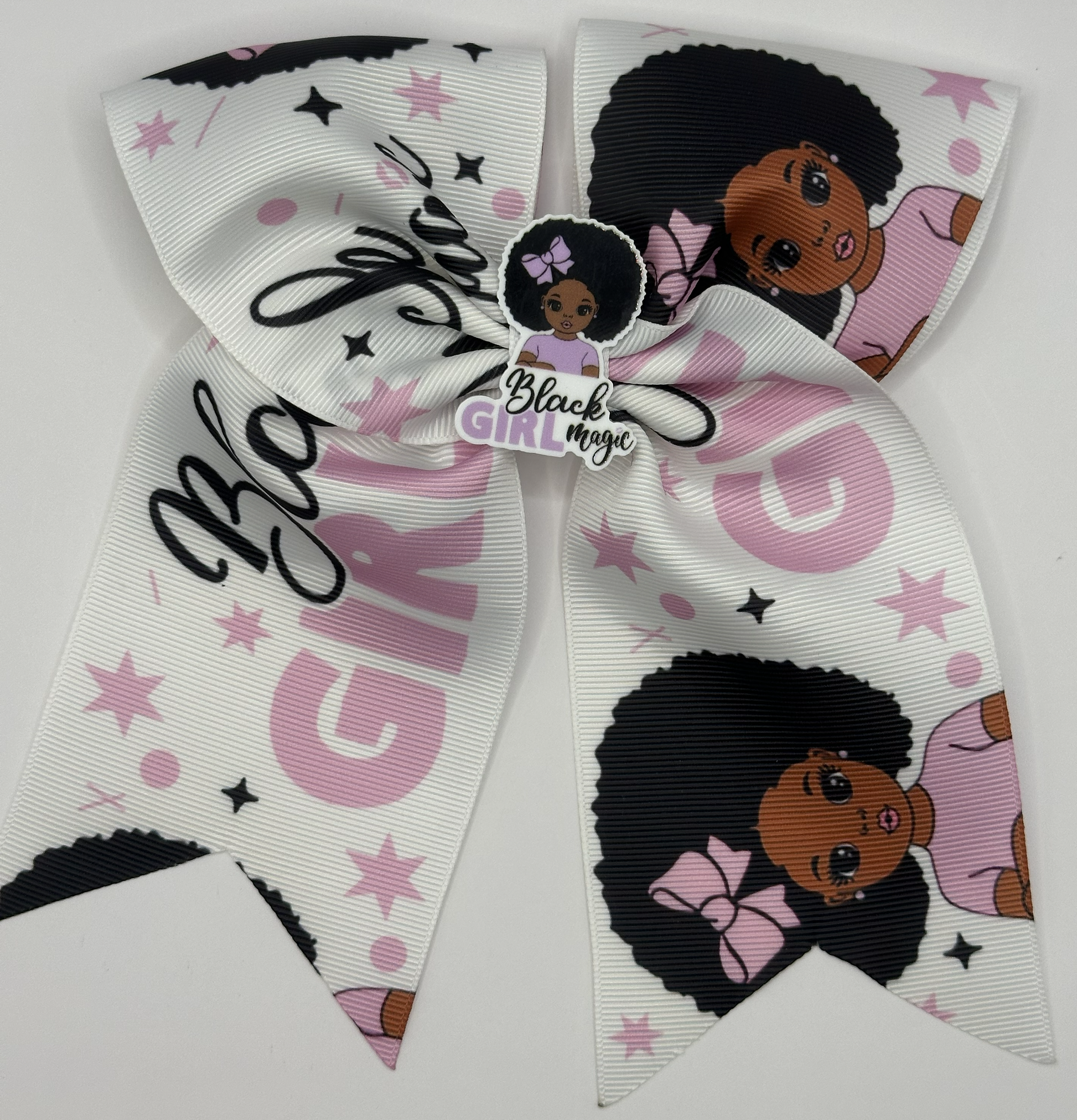 Large decorative bow with 'Black Girl Magic' text and images of a girl with an afro on a white background.
