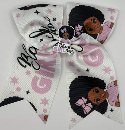 Large decorative bow with 'Black Girl Magic' text and images of a girl with an afro on a white background.