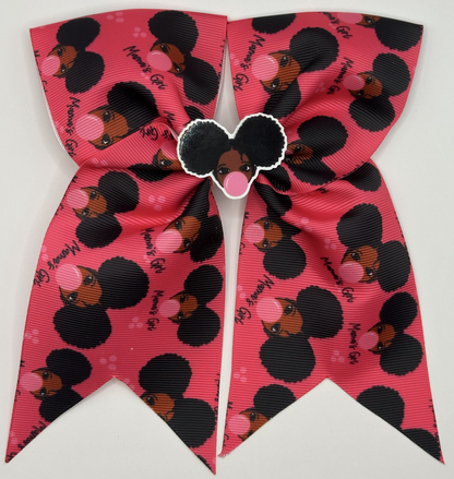 Pink and black cheer bow with a design on a white background